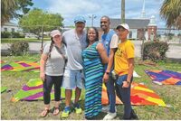 City of Florence Mayor Teresa Myers-Ervin joins community members during the Downtown Florence Community Mural Painting Event on North Dargan Street on July 9, 2022.