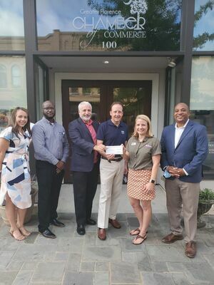 Leadership Florence Class of 2021 presents check to HopeHealth CEO Carl Humphries. Also pictured Ashton White and Tevin Leary