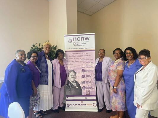 Representative Patricia Henegan is joined by guests of the National Council of Negro Women, Inc. Mary McLeod Bethune birthday celebration.
