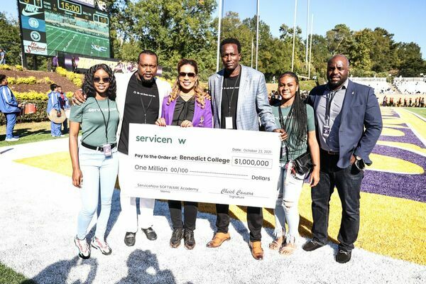 (L-R) Joining the check presentation are Shantel Thomas, Benedict College Junior Computer Science Major; Chris Rogers, Sr. Program Manager of Diversity, Inclusion and Belonging, ServiceNow;  Dr. Roslyn Clark Artis, Benedict College President and CEO; Cheick Camara, Sr. Director of Platform Engineering, ServiceNow, Dynah Banks, Benedict College Senior Finance Major, and Tyrone King, Commercials Sales Representative, ServiceNow.