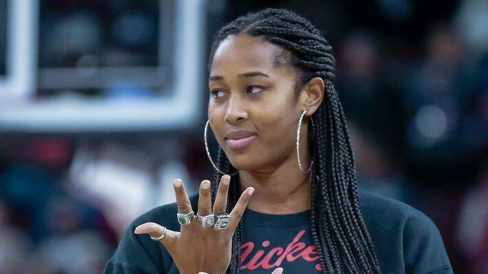 Alaina Coates admires the SEC championship ring she and other members of the 2017 team received.