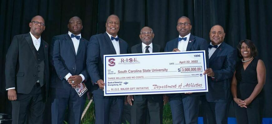 Director of Athletics, Stacy Danley and Campaign Co- Chair and Board of Trustee, Douglas Gantt, presented a check in the amount of $3 Million to Board of Trustee Chairman, Mr. Rodney Jenkins and SCSU President Col. Alexander Conyers.