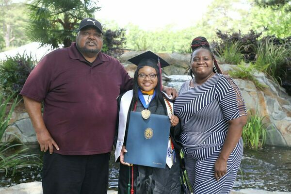 Ke’Ziyah WIlliamson (center) poses with her grandparents, Alex and Joyce Williamson following her graduation from Francis Marion University on Saturday, May 7, 2022. 
The first in her family to attain a college degree, Williamson graduated Summa Cum Laude with University Honors while earning Bachelor of Science Degree in Biology.