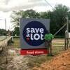 Tim Waters stands by the sign of his newly opened “Save A Lot” store in down town Florence, South Carolina.