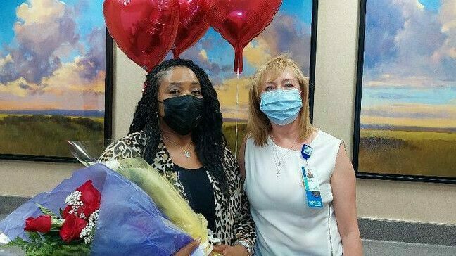 Felicia McCullough (left) a nursing assistant at Tidelands Georgetown Memorial Hospital, receives congratulations from clinical director Maya Meyers after McCullough earned the annual Caring Hearts award for her positive attitude, spirit of teamwork and the exemplary care she provides to patients.